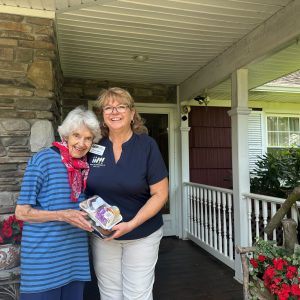 Meals on Wheels - Sharon Martini with a client of the organization.